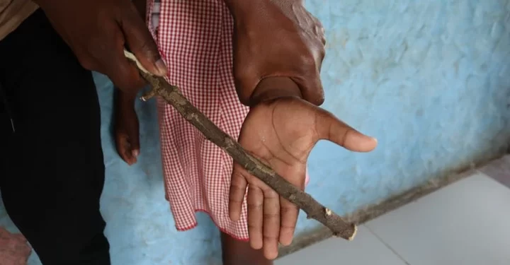 School principal in hot water for beating up students