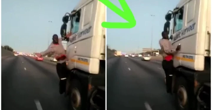 WATCH: Man caught on camera hanging from a moving truck on the highway. How did he get there?