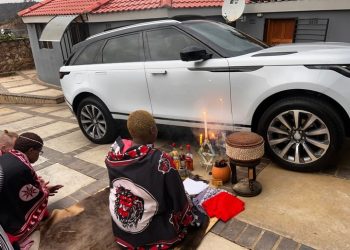 People congratulating Gogo Maweni after she bought a new car. See this