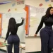 Pictures: Art teacher comes under fire for distracting students with her shape and back behind