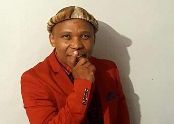 Poet shot and killed outside his house while fixing his car