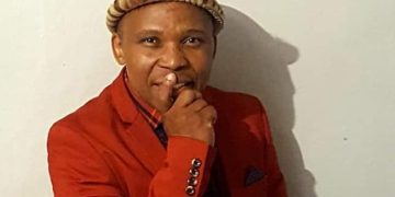 Poet shot and killed outside his house while fixing his car