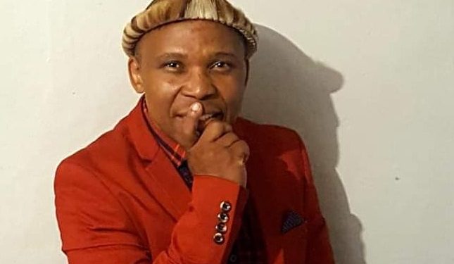 Poet shot and killed outside his house while fixing his car