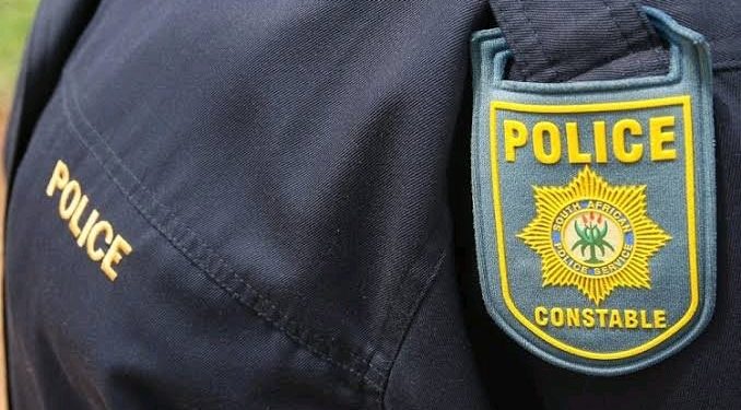 A female police officer pumped four bullets into her husband after he allegedly pulled a gun on her