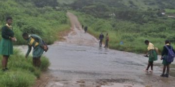 Learners In KZN Helping Each Other To Cross A River That Has Claimed Many Lives